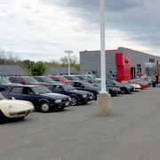 A few shots of our club members' Alfas lined up in the dealer's lot