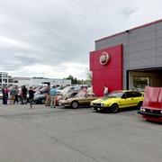 A few shots of our club members' Alfas lined up in the dealer's lot