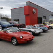 A few shots of our club members' Alfas lined up in the dealer's lot