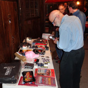 George Dolak examines the door prize table, hoping to get his number drawn early...