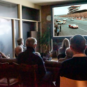The movie under way, the crowd paying rapt attention