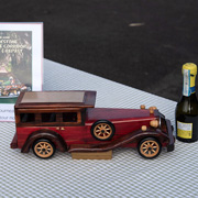 The wooden touring car model with brass plaque contributed by Tom Letourneau to be awarded to the winners of the rallye
