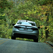 The Pellegrinos cresting a rise in their Giulia Q4