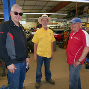 Paul Glynn (c) holds court inside the shop