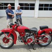 Michael Wrigley (r) and friend admire a vintage Italian two-wheeled conveyance