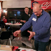 Roger Cassin successfully levitating one of the door prizes