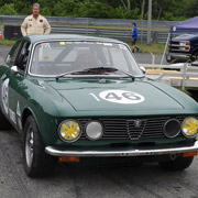 Bill standing behind his GTV race car