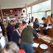 The pizza arrives and everyone digs in