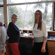 Roberta and Meg making use of the kitchen cutting board