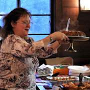Dessert time - Deb Donovan placing her contribution