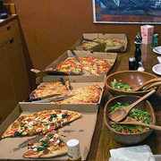 An 'after' shot of the pizzas having been mostly decimated