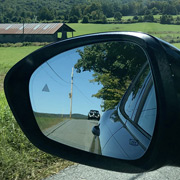 The Cassin 1900 CSS caught in the mirror of the 65-year-newer La Sala Stelvio