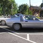 The first two cars to reach the assembly point, AONE-ers enjoy the sun at the Four Leaf Clover
