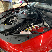 The engine bay of Tom's Giulia Quad